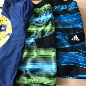Two boys swimsuits size L and a beach shirt